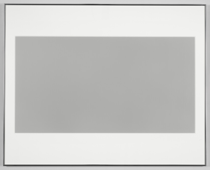 A framed grayscale gradient image transitioning from white to black, displayed on a white background.