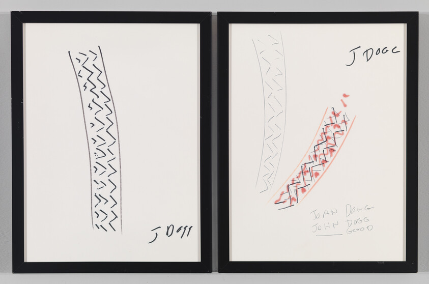Two framed pieces of artwork side by side. The left frame contains a simple black line drawing of a zigzag pattern. The right frame shows a similar zigzag pattern with additional red scribbles and several handwritten annotations in black ink. Both pieces are signed and dated at the bottom.