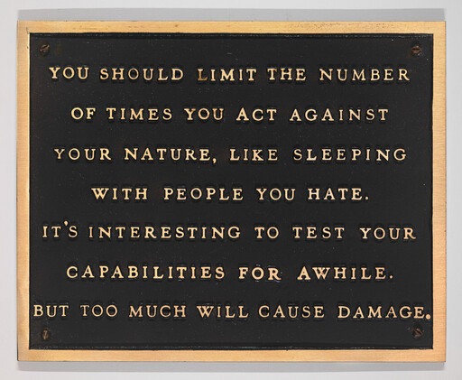 A black plaque with gold letters advising to limit acting against your nature, like sleeping with people you hate.