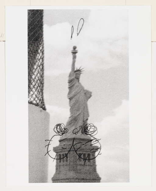 The Statue of Liberty with black scribble drawings and circles over its base and pedestal.