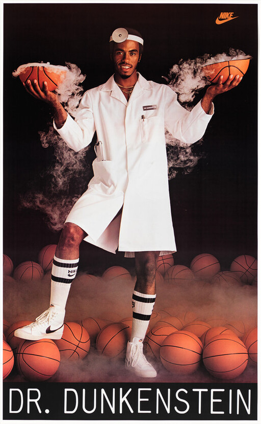 Dr. Dunkenstein dressed as a doctor holds two steaming basketball halves above many basketballs.