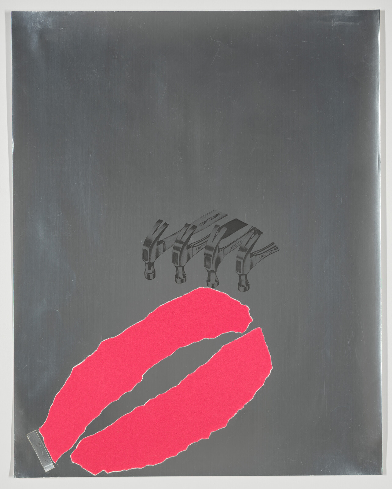 Large torn pink paper lips taped on a gray metal sheet with small hammer heads above.