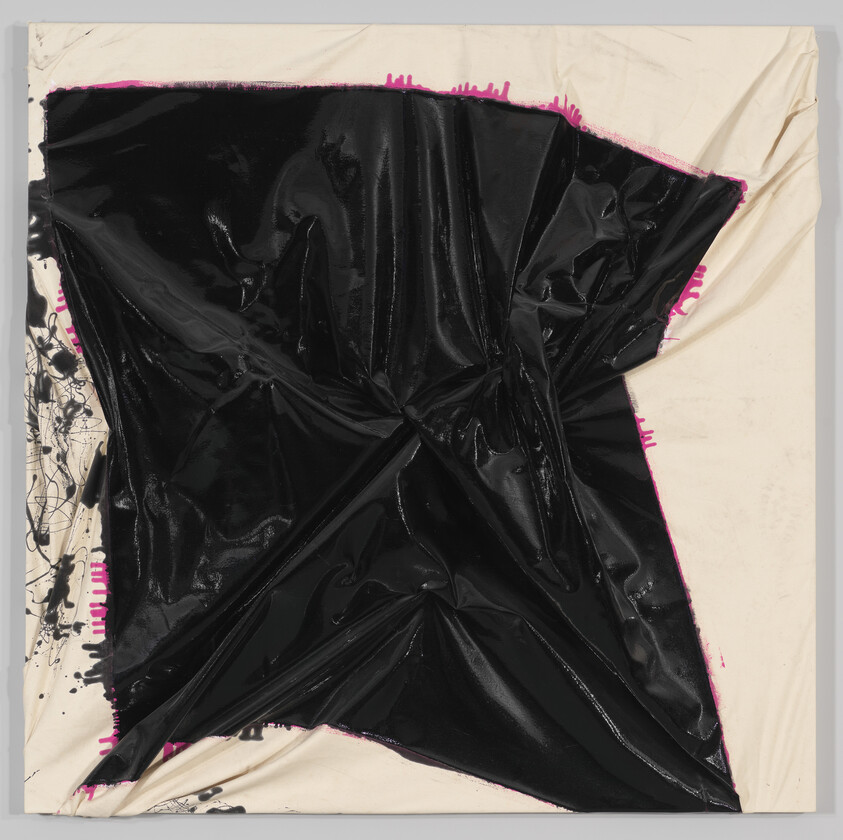 A large glossy black sheet crumpled and stretched over a beige canvas with bright pink edges.