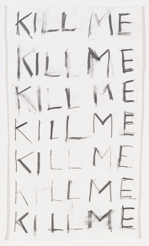 White sheet with the words "KILL ME" written repeatedly in charcoal-style black letters.