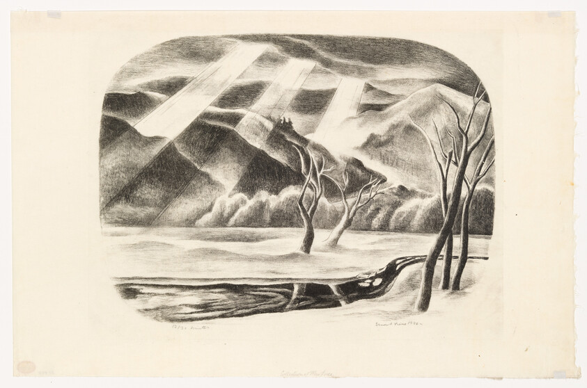 Sunbeams break through clouds over snowy mountains, reflected in water around bare twisted trees.