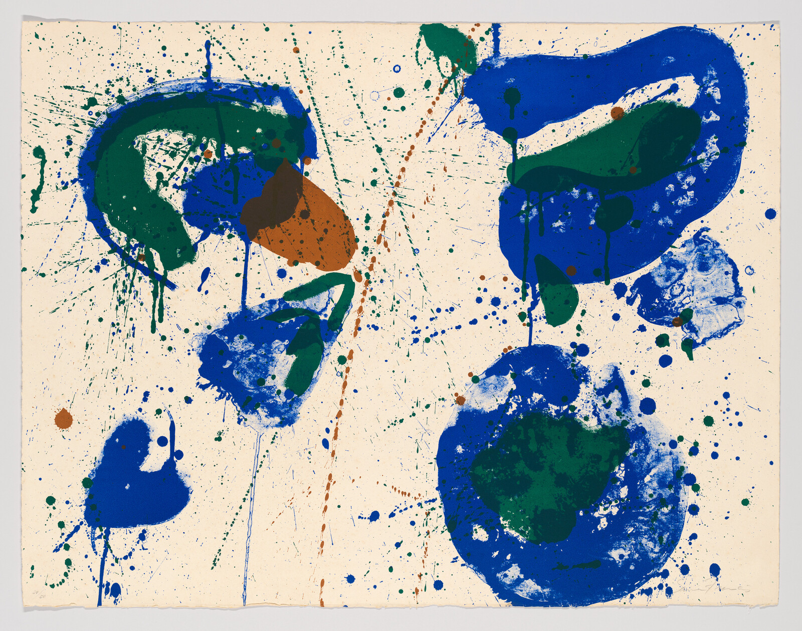 Large blue and green paint splashes and drips scatter across a cream-colored background.