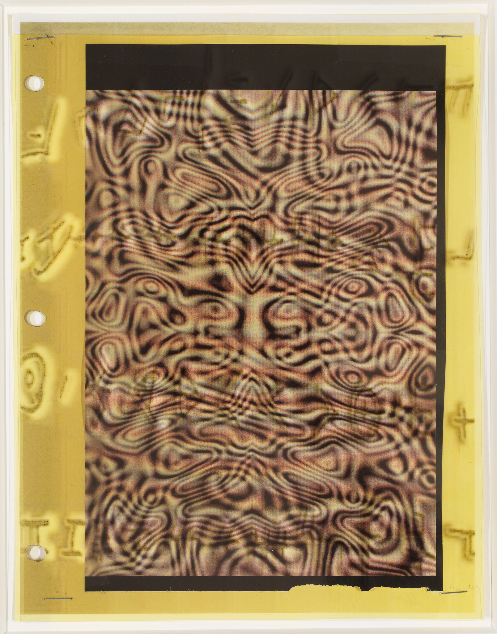 Rectangular sheet with brown and black swirling patterns mounted on a yellow border with punched holes.