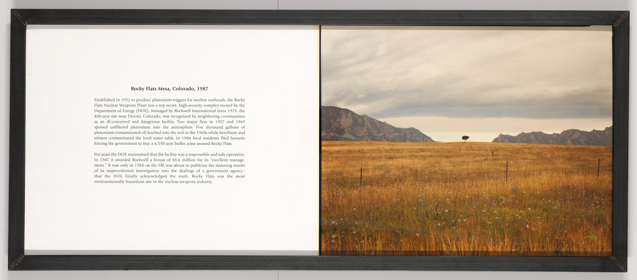 Framed diptych shows explanatory text about Rocky Flats Mesa, Colorado, 1987 alongside a grassy field with distant mountains.