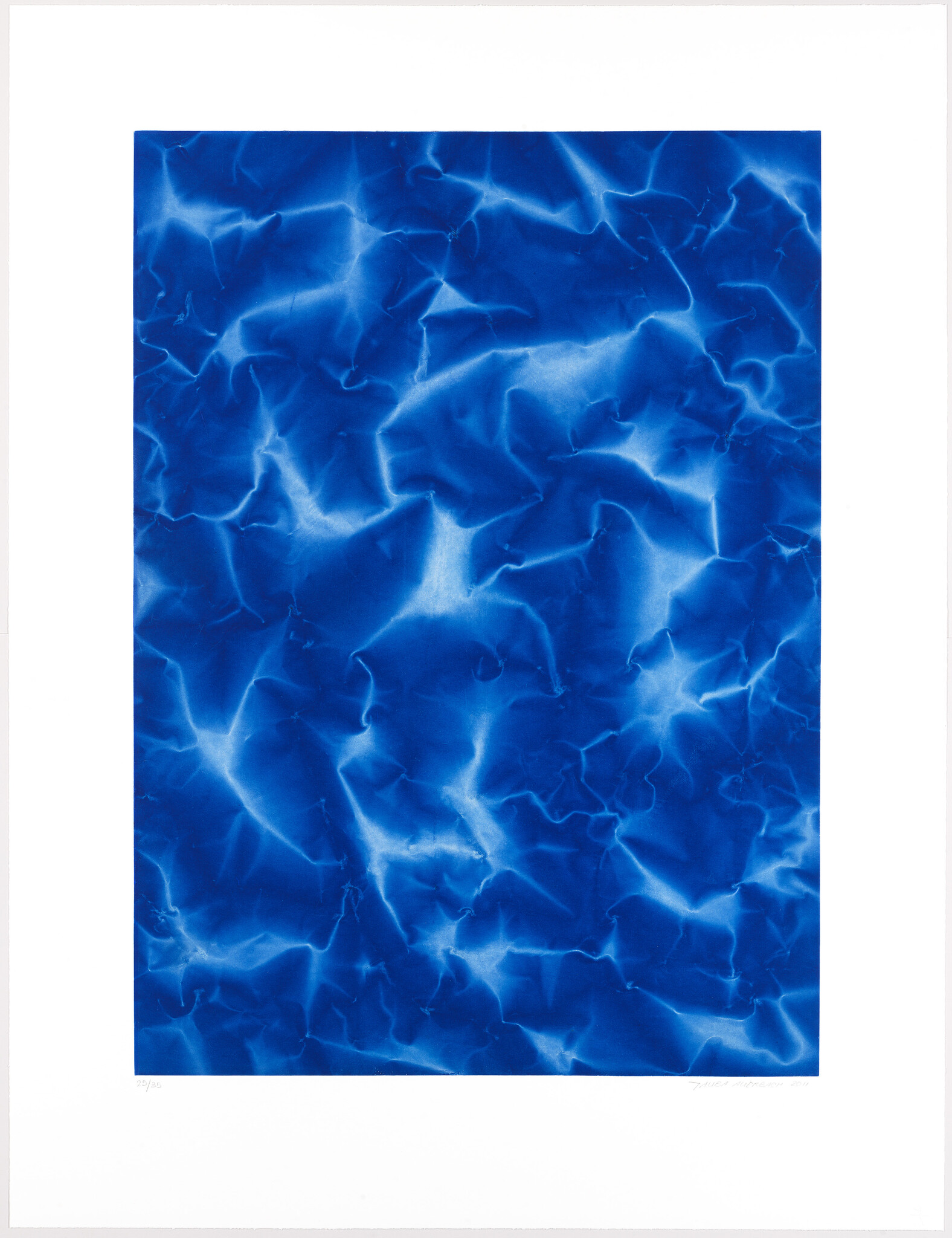Deep blue abstract pattern resembling light reflecting on rippling water within a white border.