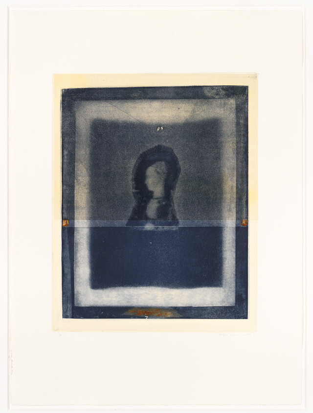 Blurry dark blue print shows a centered silhouetted head and shoulders inside a lighter rectangular frame.