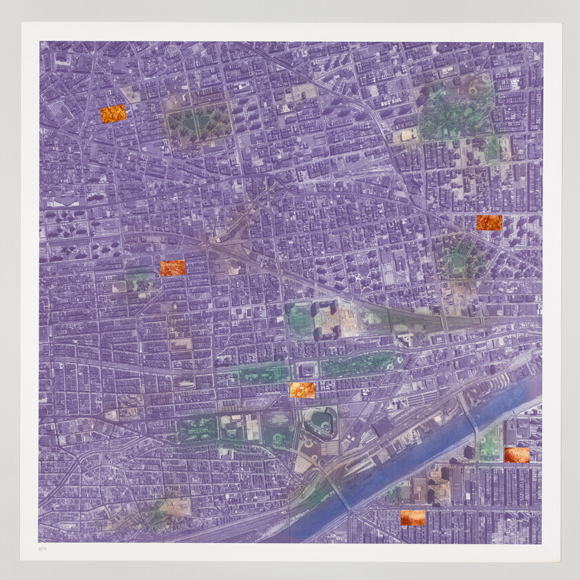 Aerial view of a city grid with streets and buildings, highlighted by several bright orange squares.