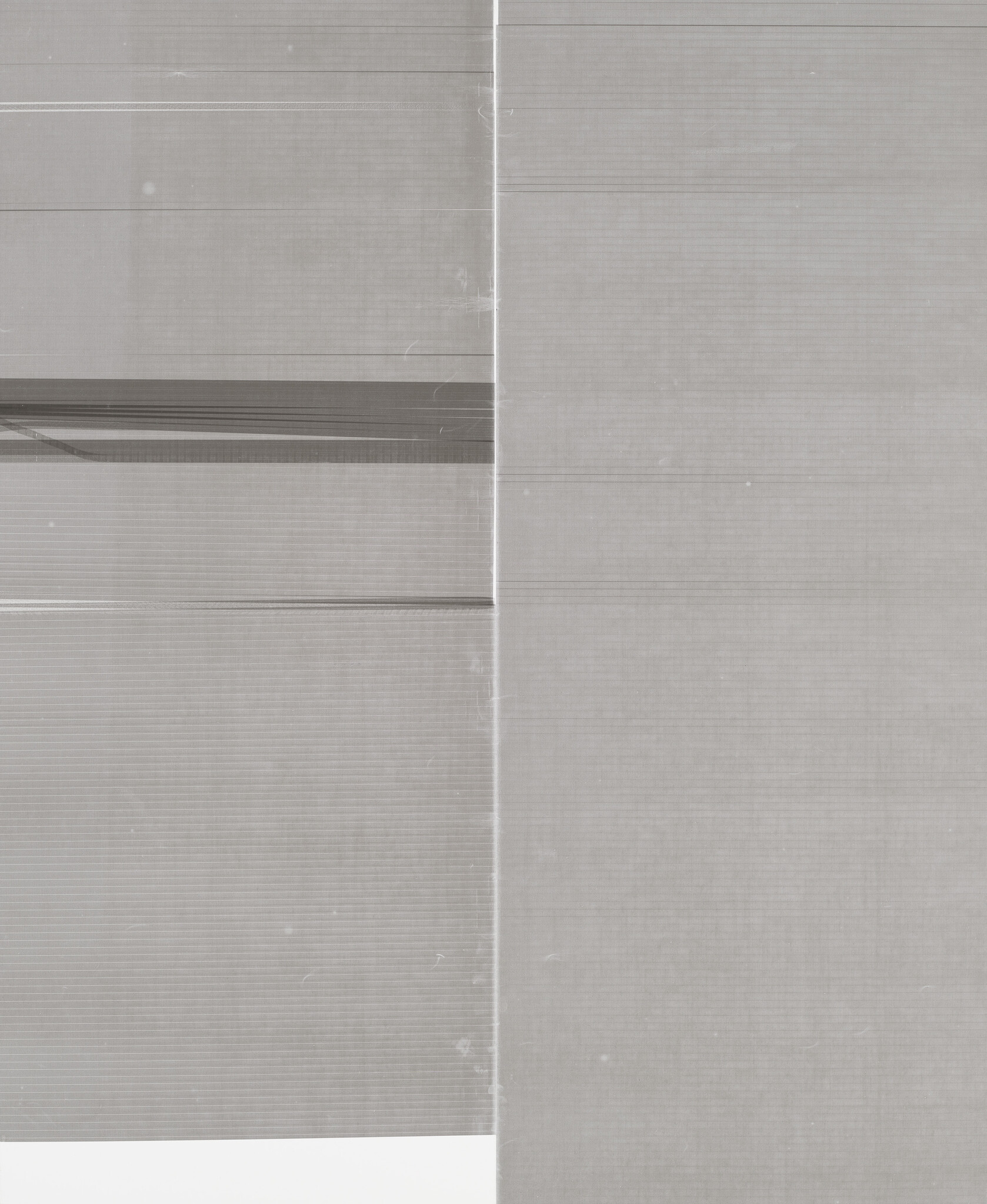 Two-tone gray fabric panels with a vertical seam and subtle horizontal lines across the surface.