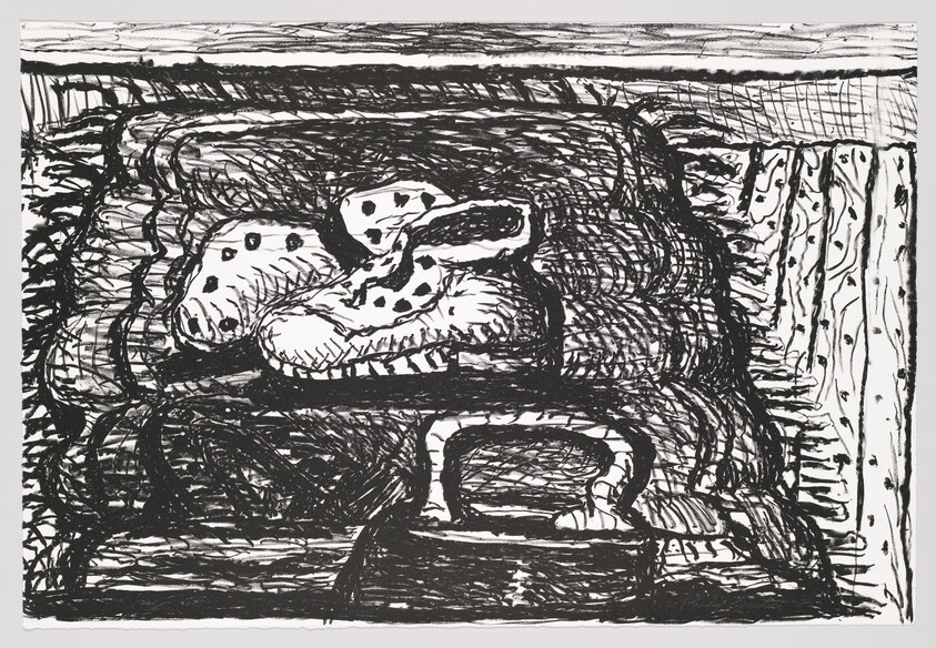 A patterned oven mitt rests on a textured surface with an iron placed in front of it.