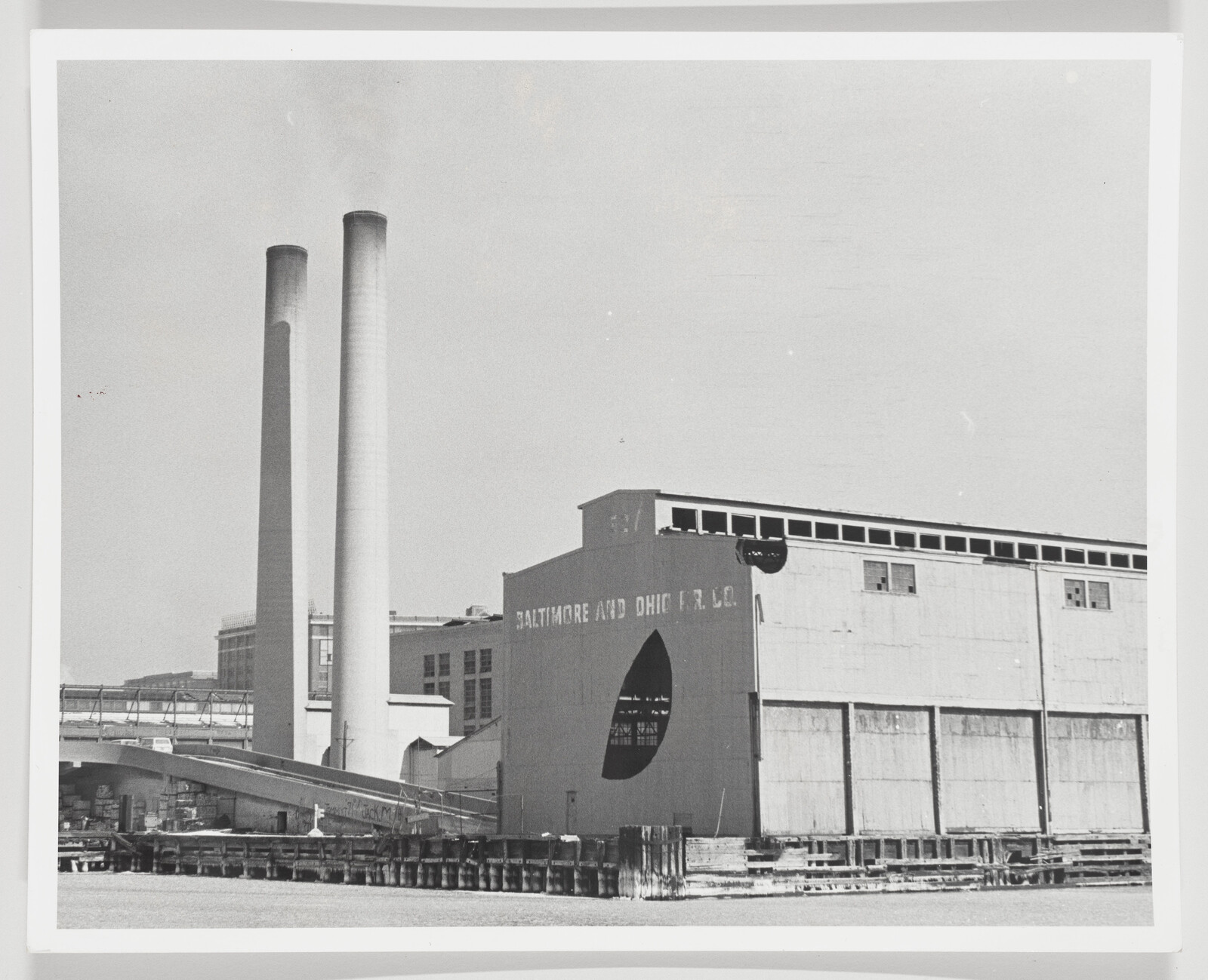 Large industrial waterfront building labeled Baltimore and Ohio F.R. Co. with two tall smokestacks.