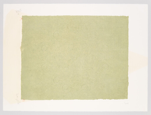A pale green textured rectangle with faint concentric circle patterns centered on off-white paper.