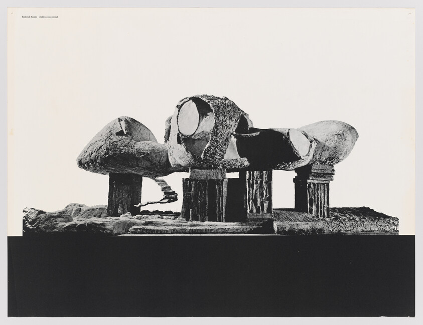 Black-and-white model of a surreal pod-like sculpture resting on several columnar supports.