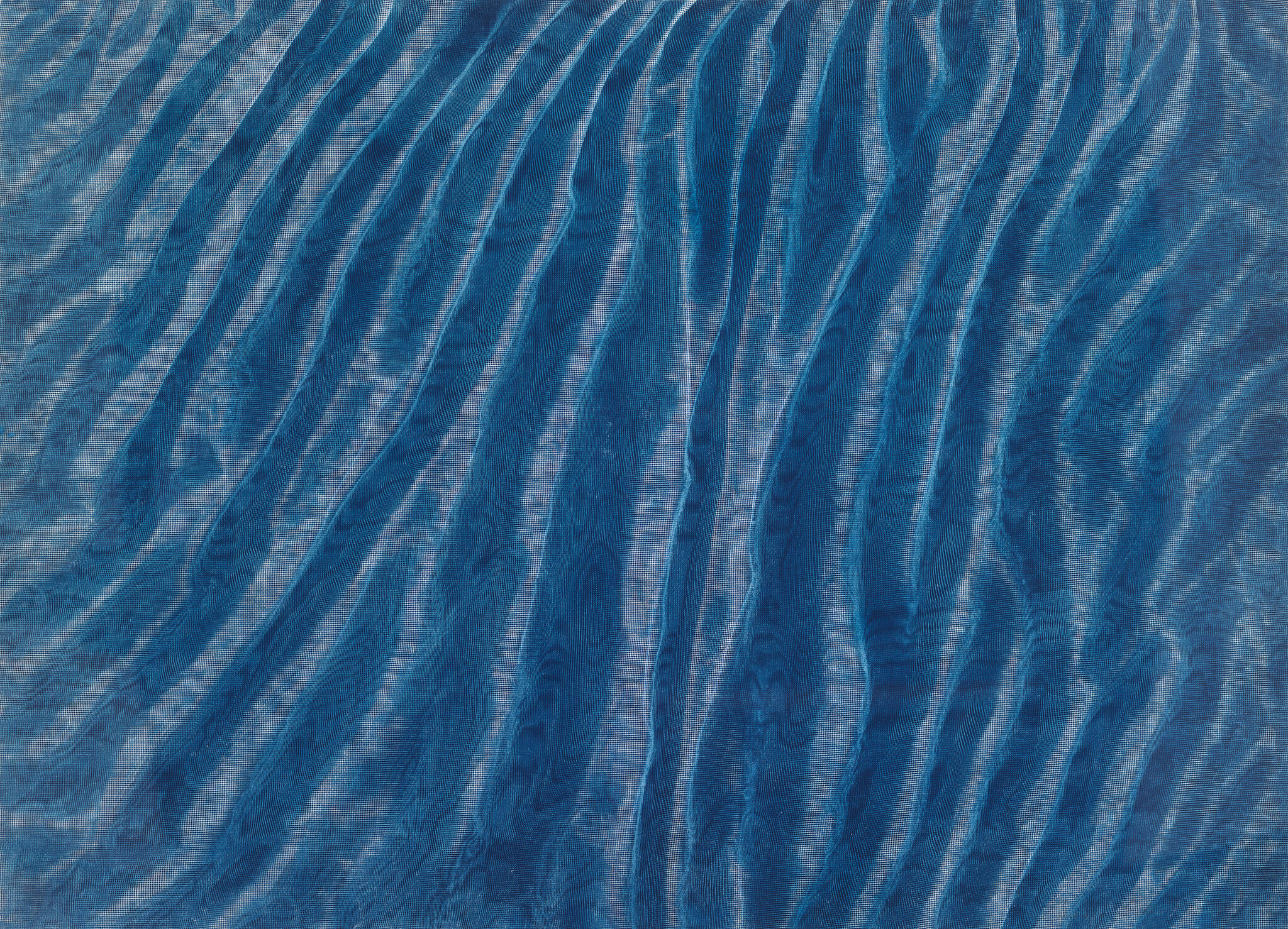 Blue sheer fabric with diagonal wavy folds creating light and dark rippled stripes.