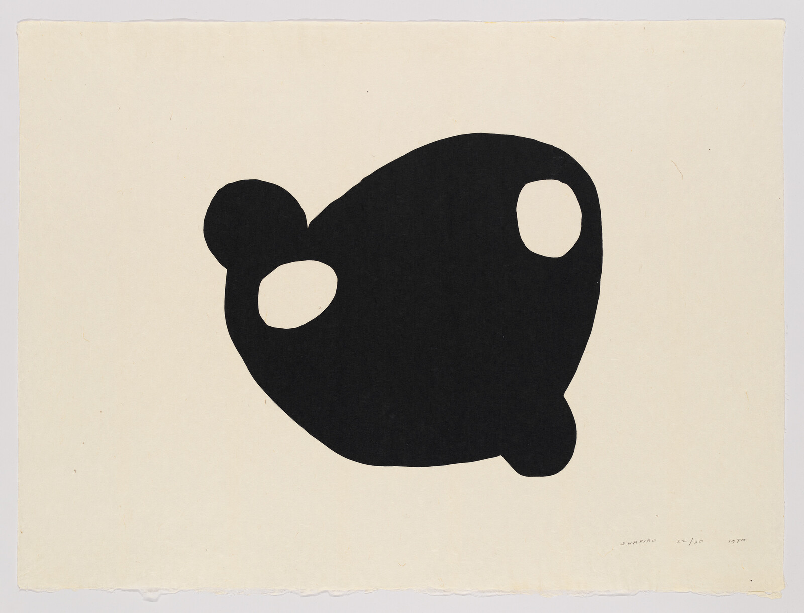 Large black abstract shape with two white oval cutouts on a plain off-white background.