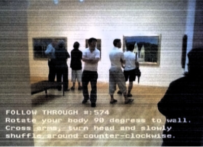 People view gallery paintings while on-screen instructions prompt rotating body 90 degrees and shuffling counter-clockwise.