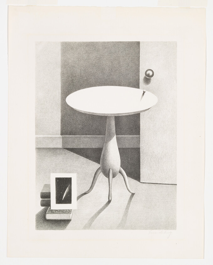 A small round pedestal table casts long shadows beside a door and framed picture on books.