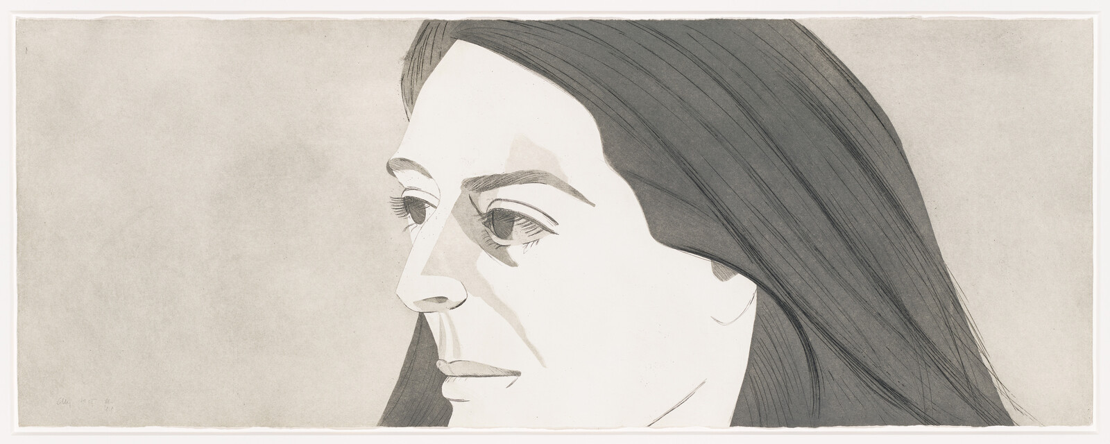 A side portrait of a woman with long dark hair and a thoughtful expression.