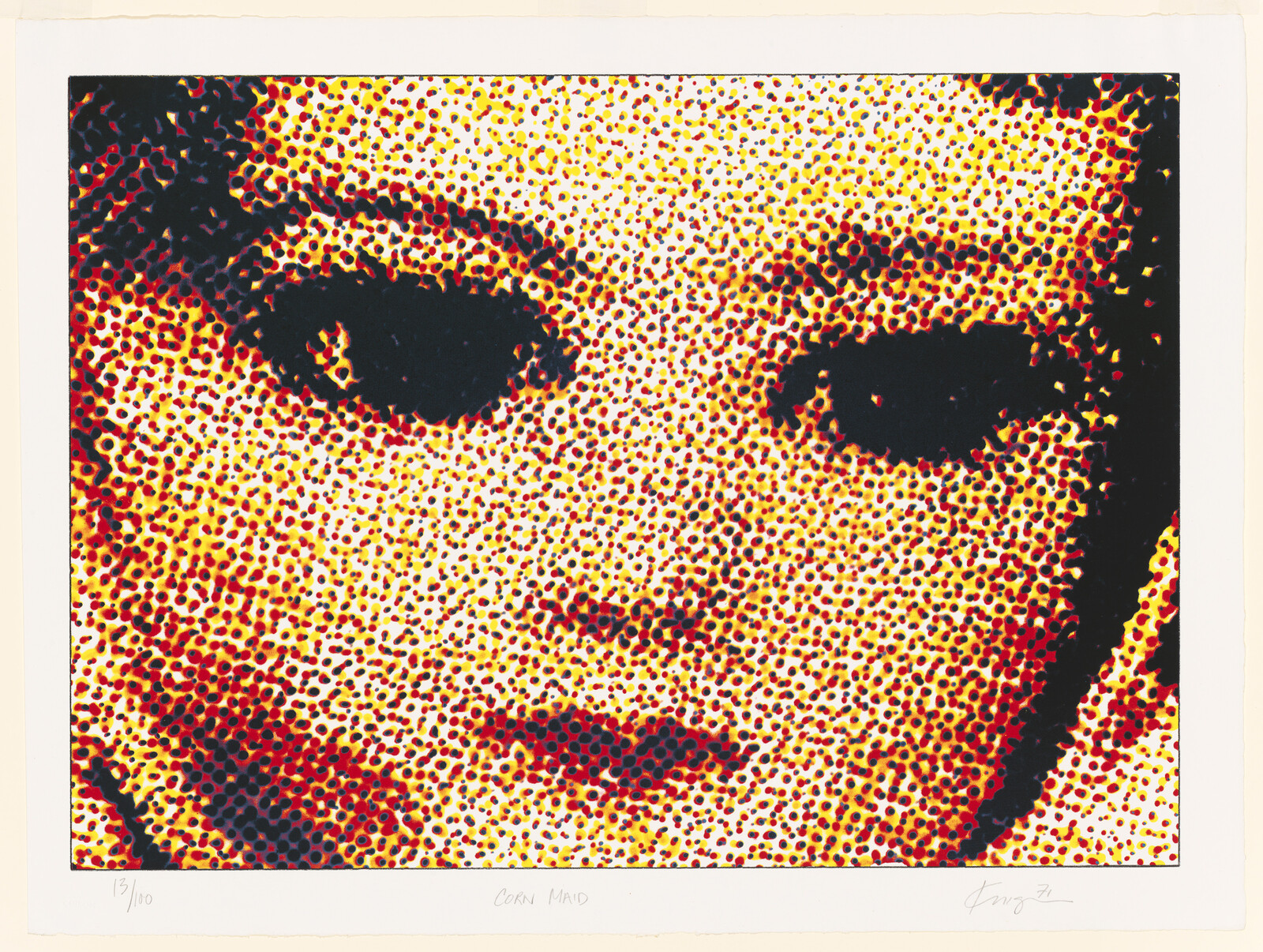 Close-up halftone portrait of a face composed of red, yellow, and black dots.