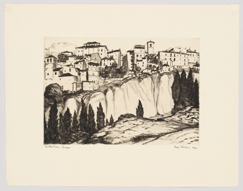 A hilltop town with clustered buildings perched above steep cliffs and cypress trees.