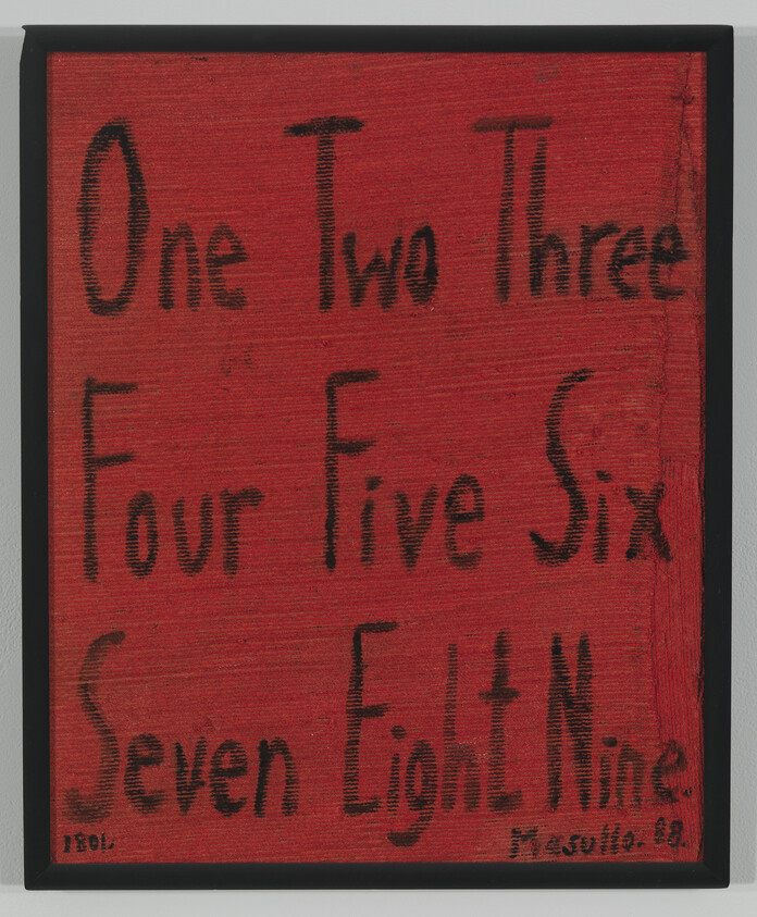 Red framed board with numbers written in black words from One to Nine in three rows.