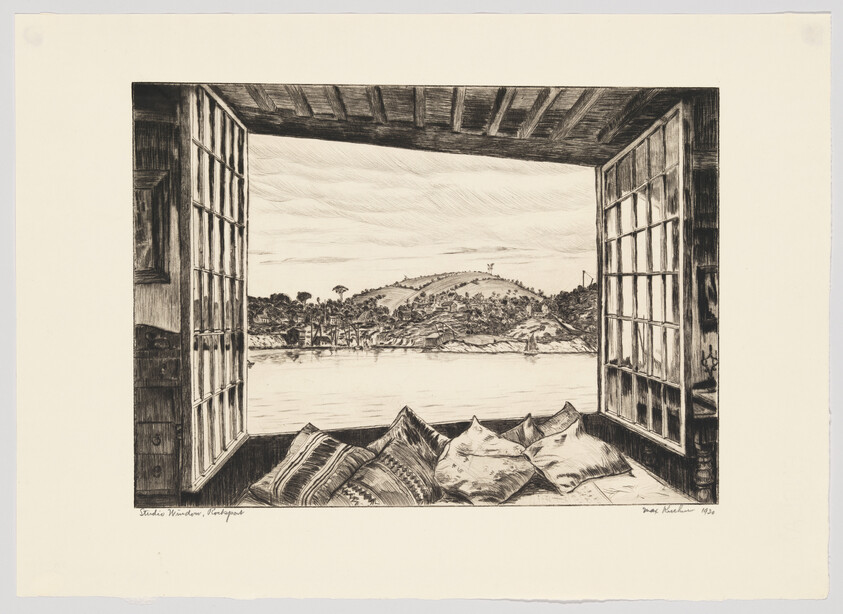 Open wooden window frames a lake and distant hills, with cushions piled on the sill.