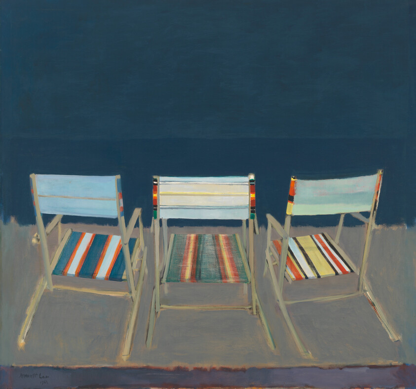 Three striped folding chairs sit side by side facing a dark calm sea.