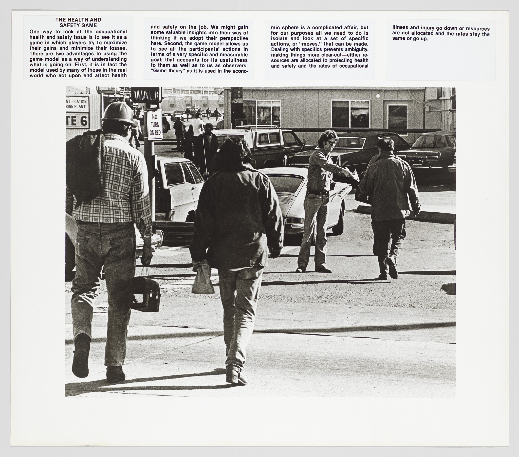 Three workers walk across a street toward parked cars while a man gestures to them.