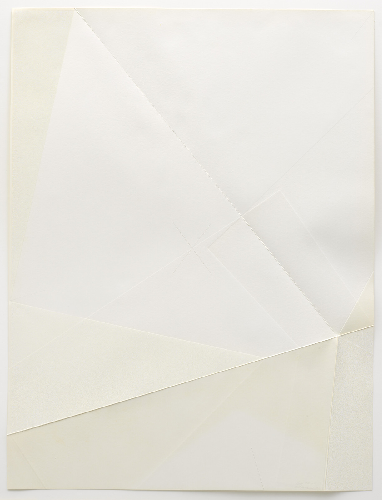 Overlapping folded white paper forms geometric shapes with subtle creases and shadows across the surface.