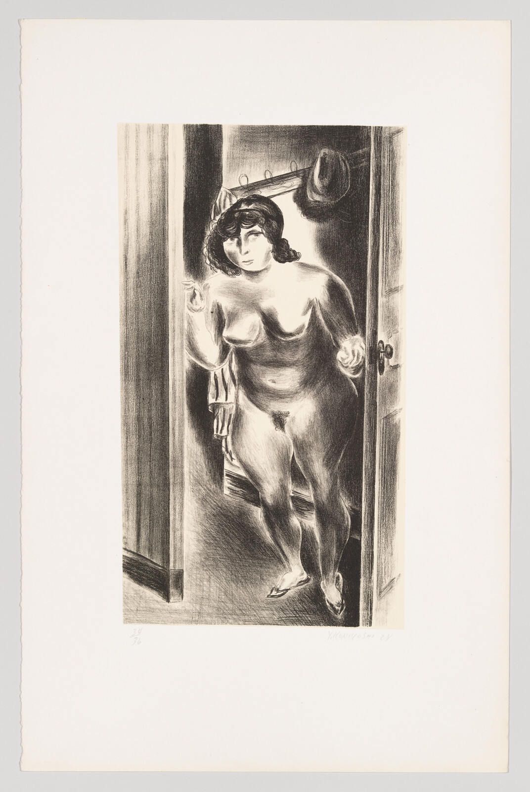 A nude woman stands in a doorway looking toward the viewer with a hat hanging behind her.