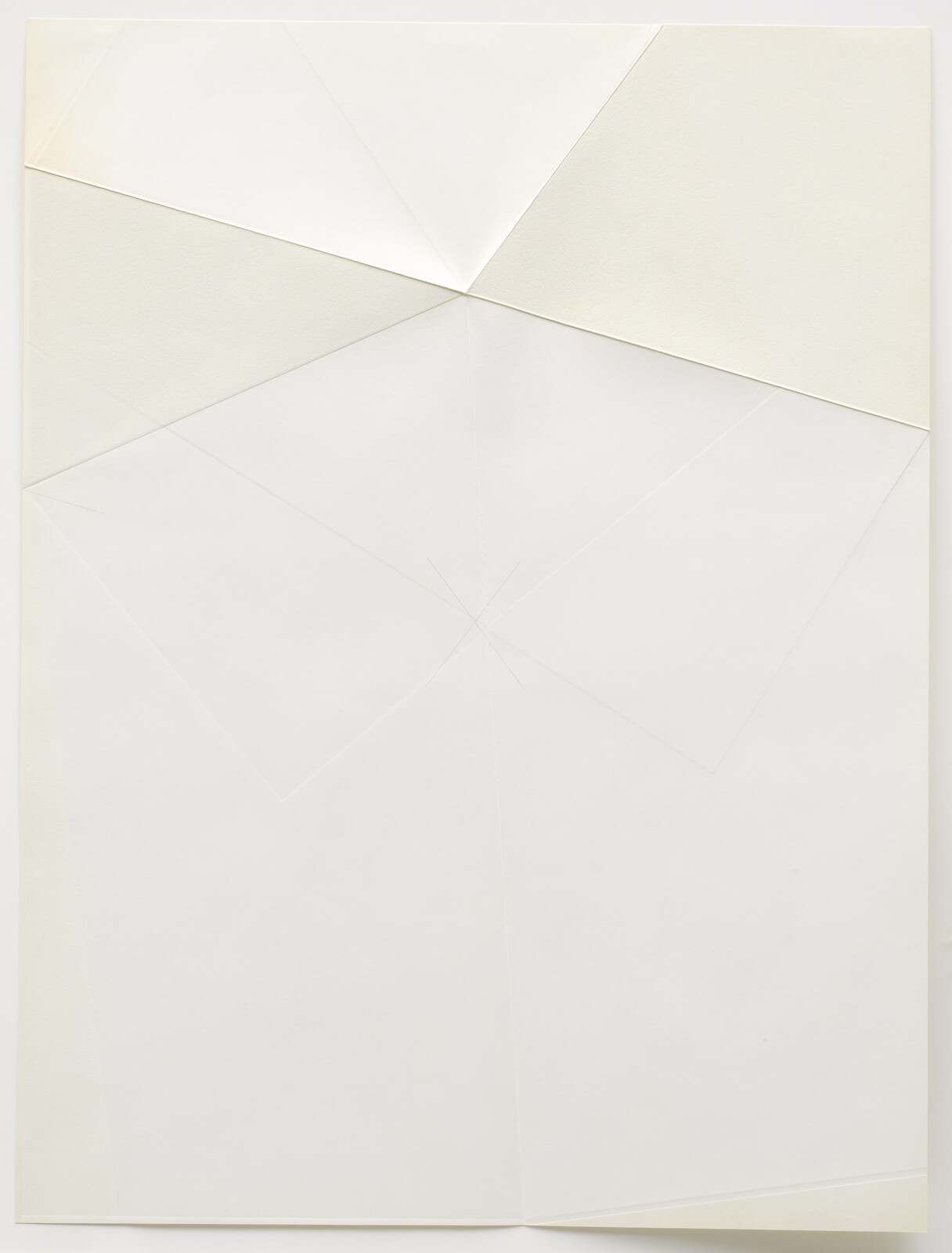 Large white sheet of paper with subtle folded geometric shapes and creased lines.