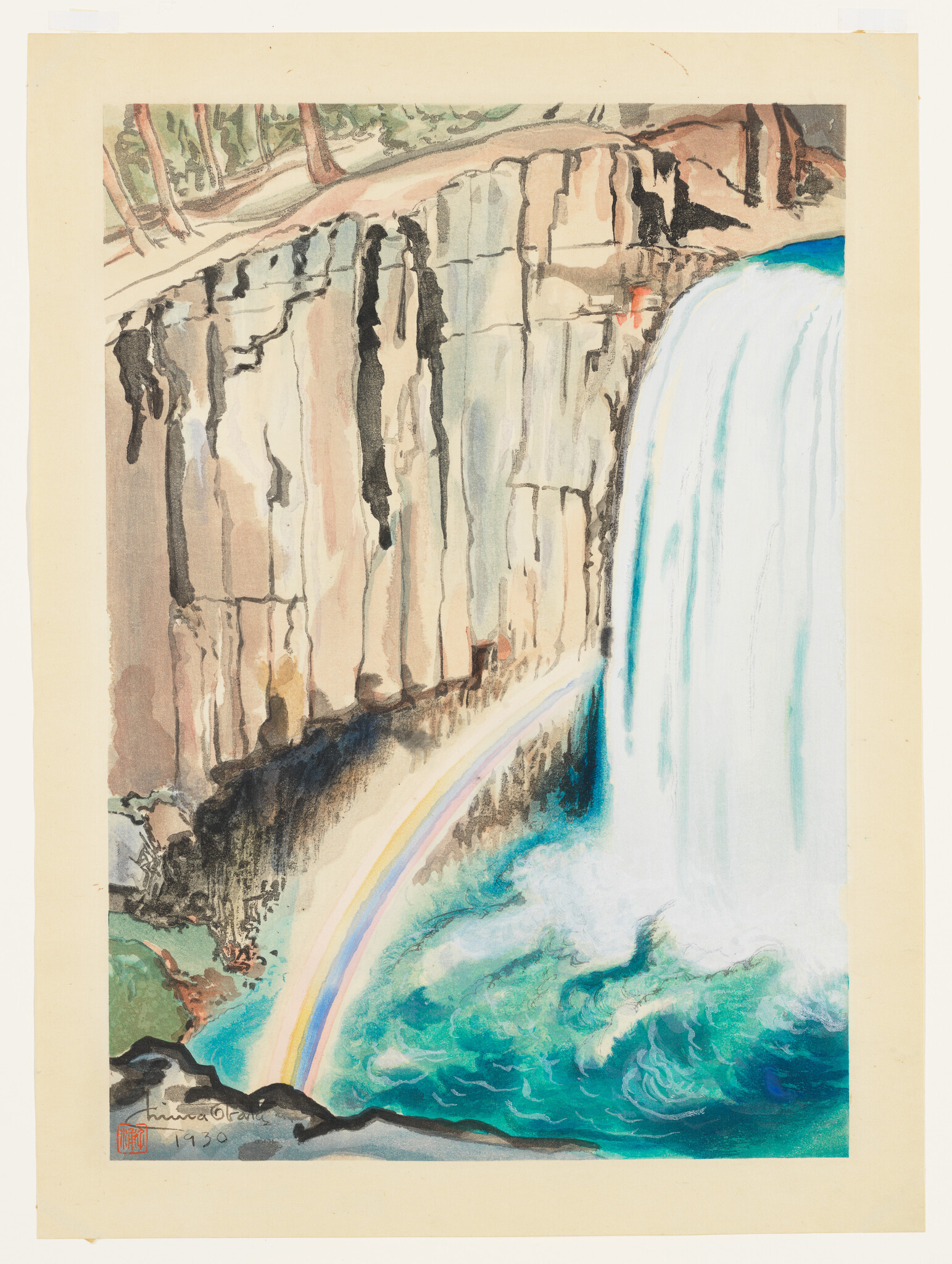 A tall waterfall plunges beside a rocky cliff, creating a rainbow over turquoise water.