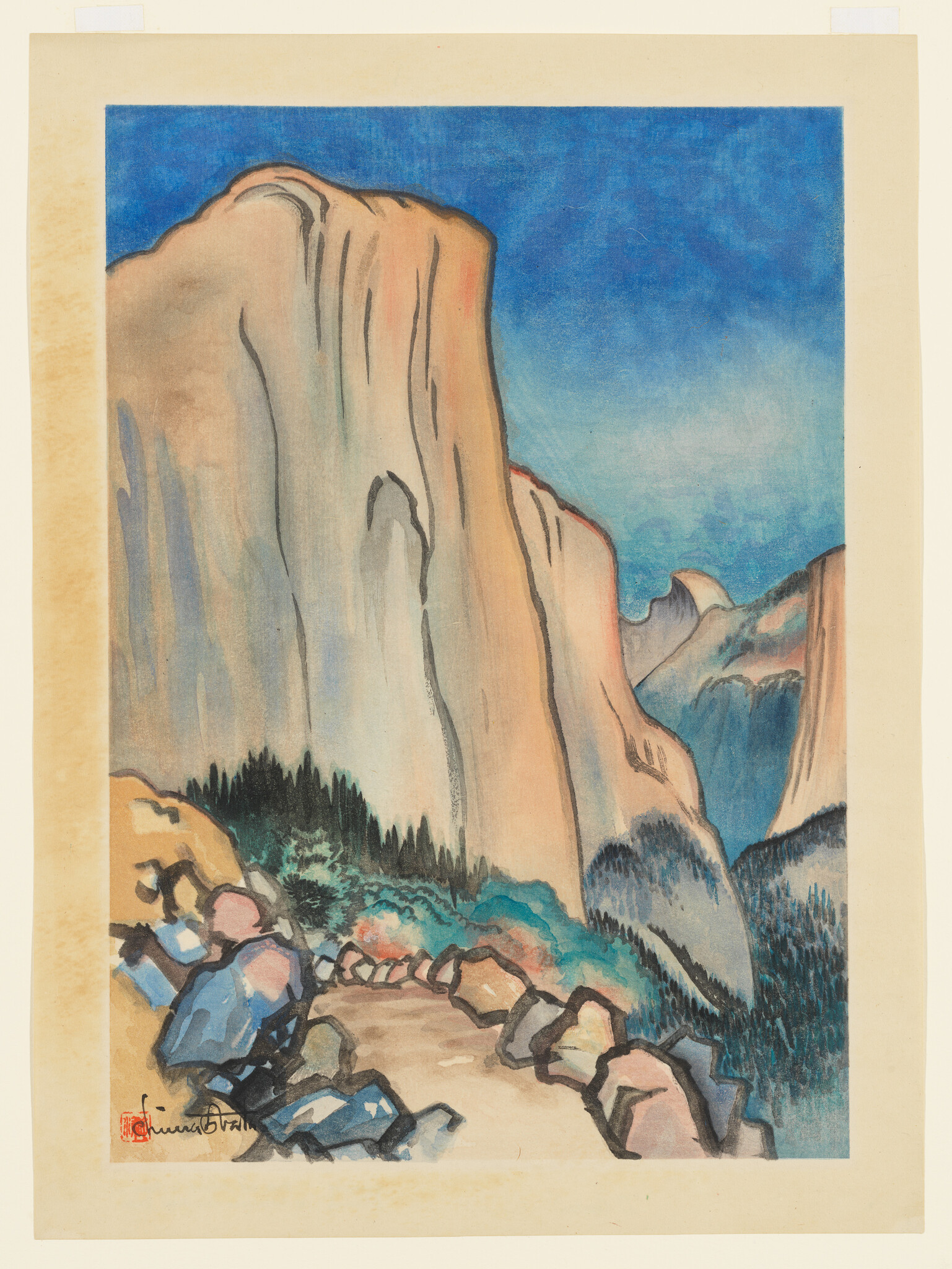 Tall sheer granite cliffs tower over a winding rocky trail bordered by trees and boulders.