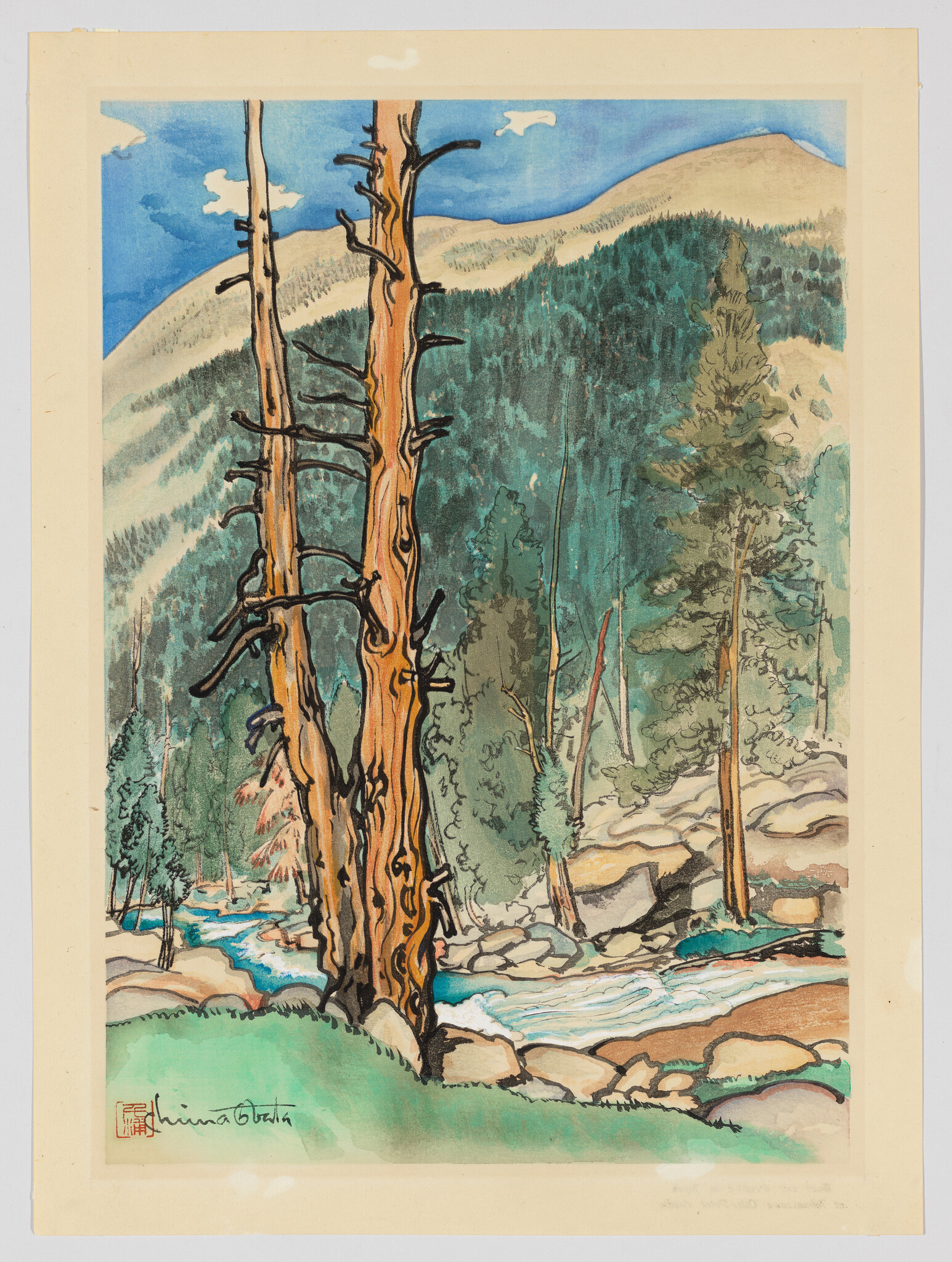 Two tall weathered pine trees stand beside a rocky stream with forested mountains behind.