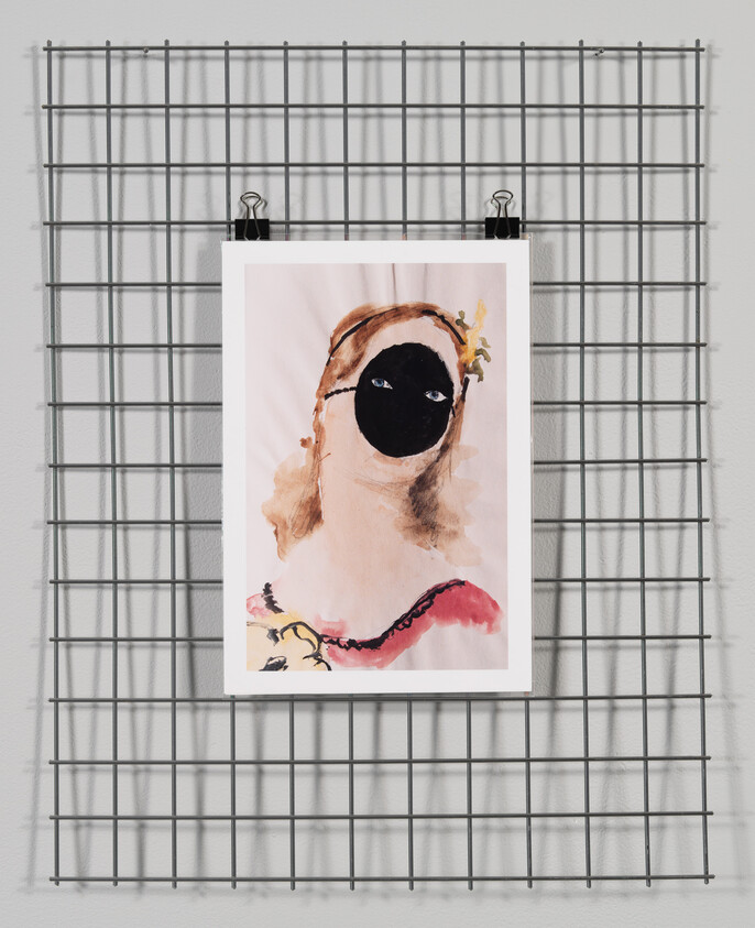 A watercolor portrait with a solid black face and visible eyes clipped to a metal grid.