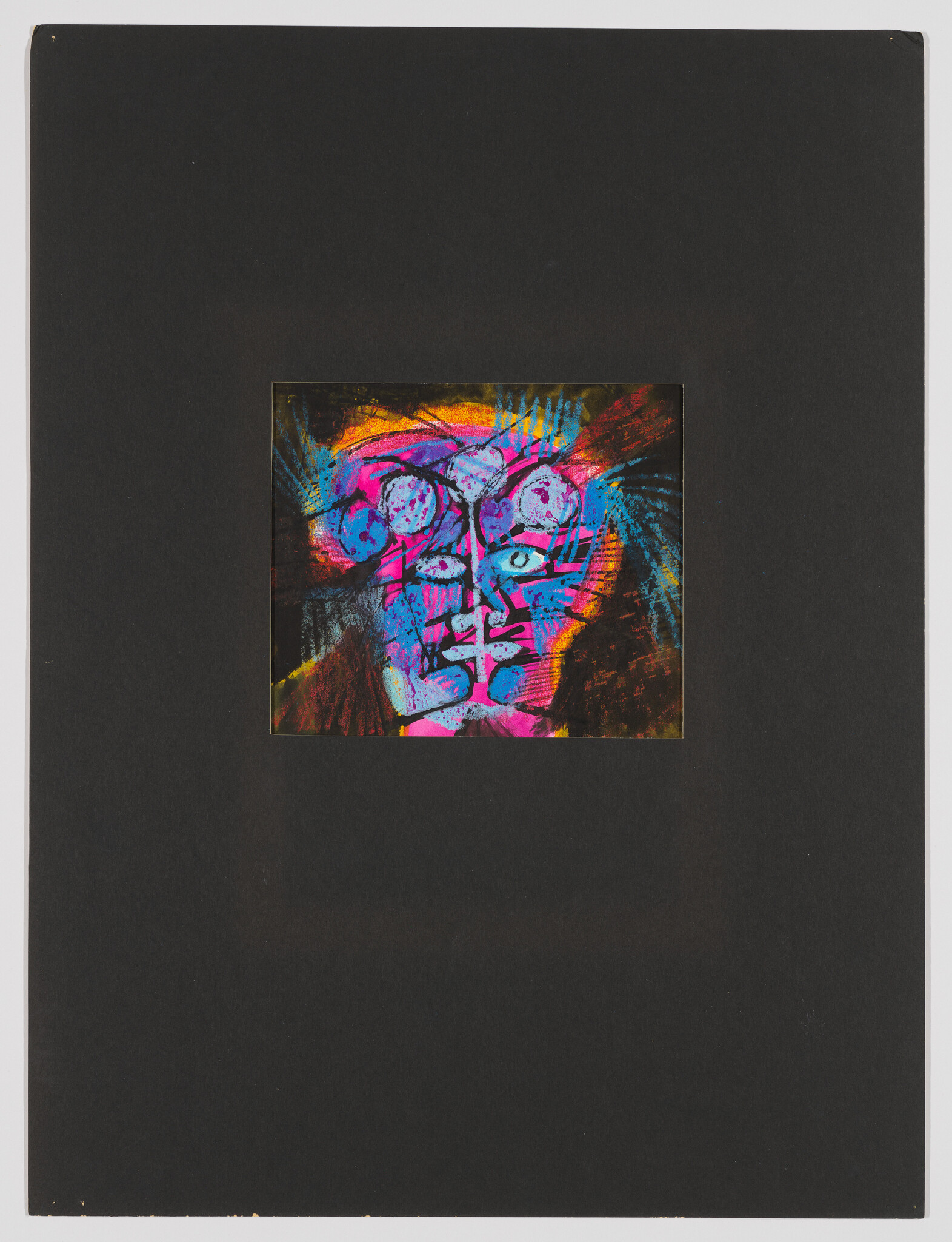 A small vibrant abstract face painting with bright blues, pinks, and yellows centered on a large black mat.