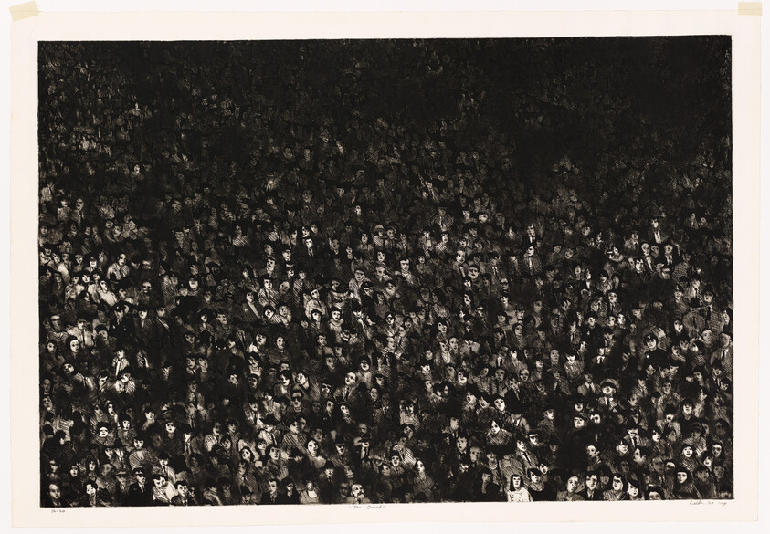 A dense crowd of dozens of closely packed faces fills the darkened space.