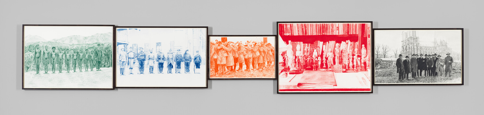 Five framed panels show historical group photos and a red book and figurines displayed on a gray wall.