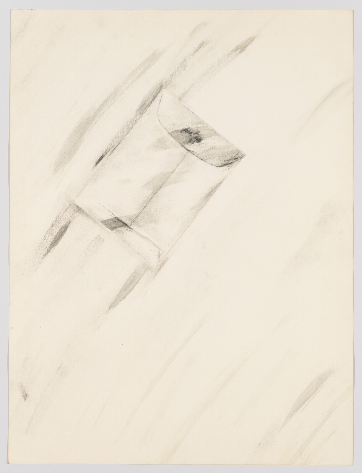 A simple charcoal drawing of a tilted envelope with soft smudged shading around it.