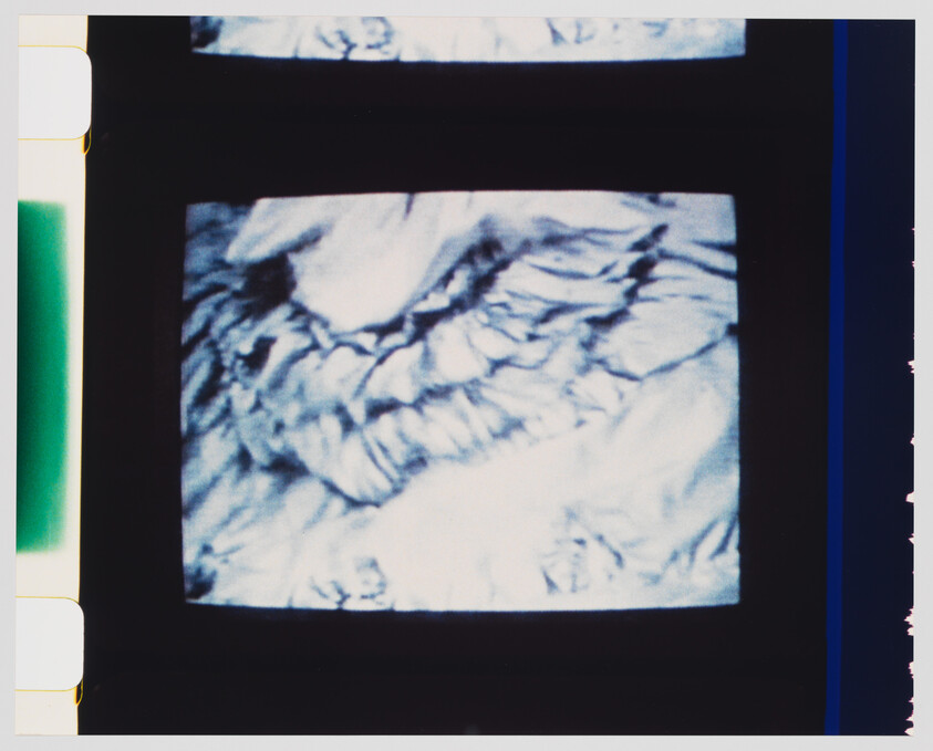 A television screen showing swirling blue and white abstract marble-like patterns.