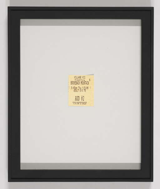 A framed small movie ticket for Brokeback Mountain centered on a large white mat.