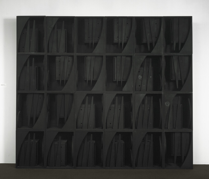 Large black shelving unit with 25 cubbies, each holding several vertical panels or folders.