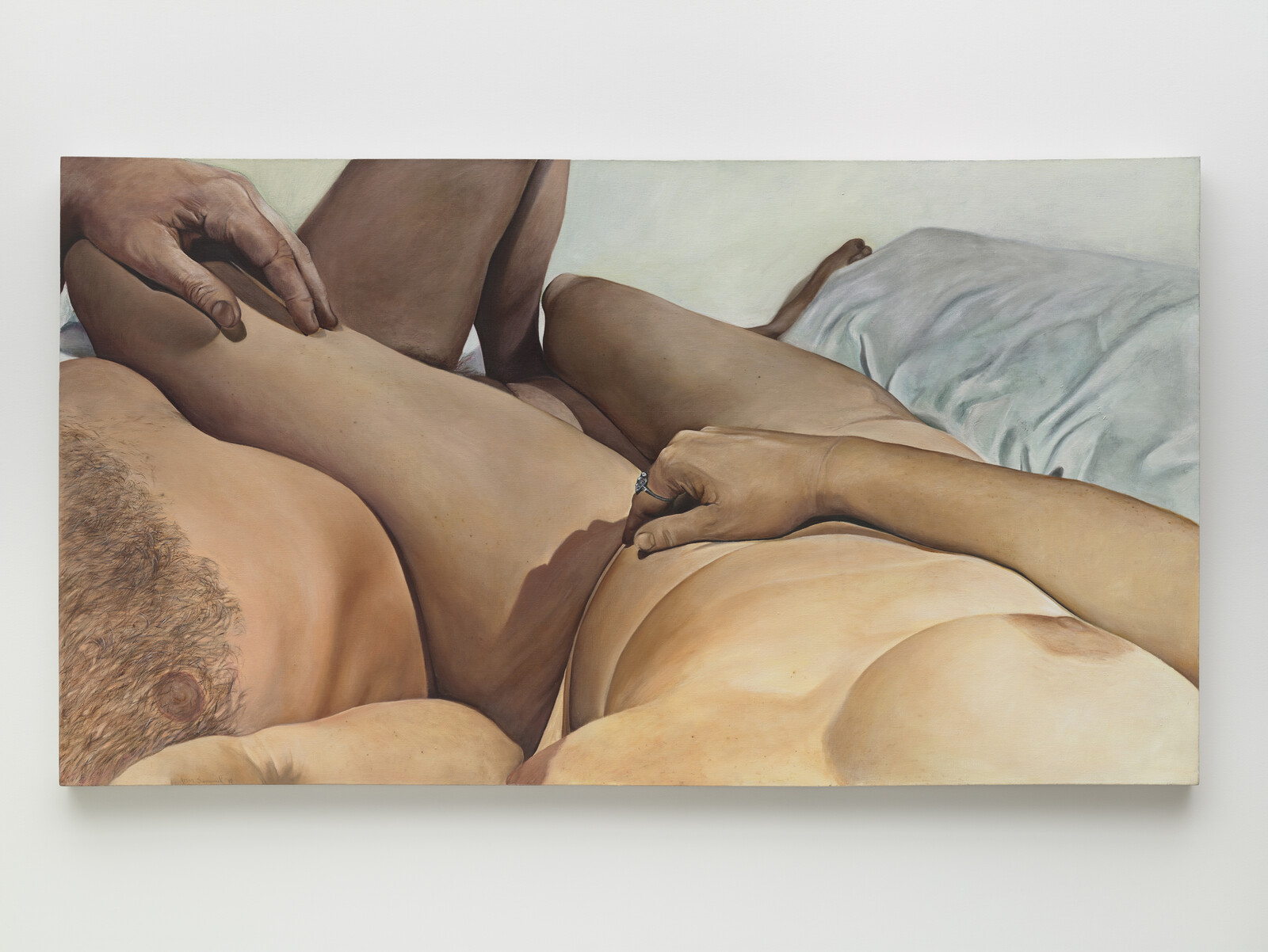 Two nude figures lying closely together, one with a hand resting on the other's hip.