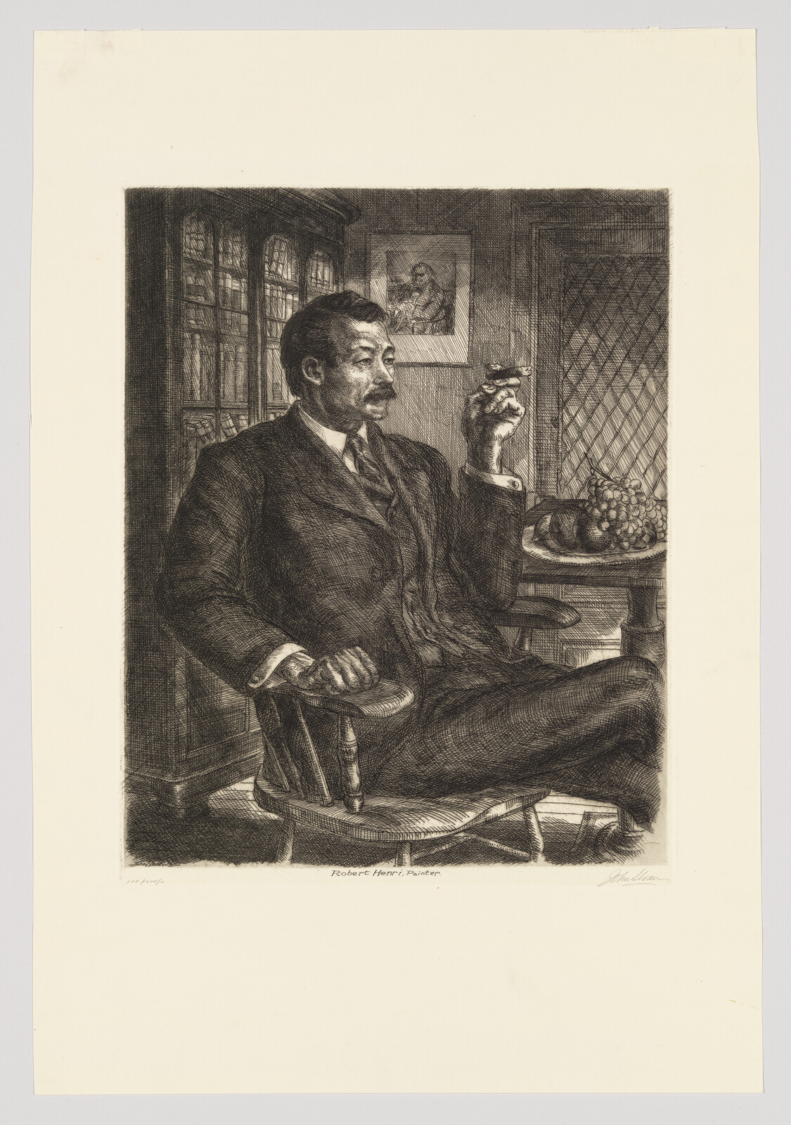 A man in a suit sits in a chair holding a cigar and looking to the side.