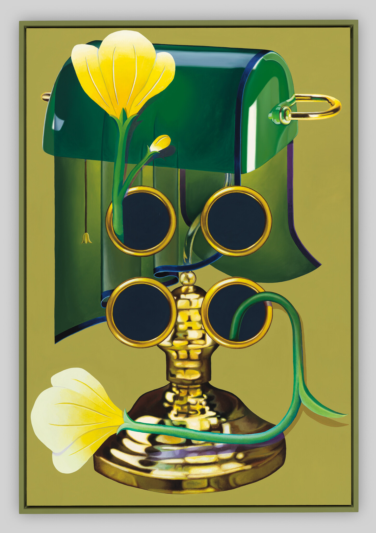 Green banker-style lamp with yellow flowers entwined around a brass four-lensed eyeglass stand.