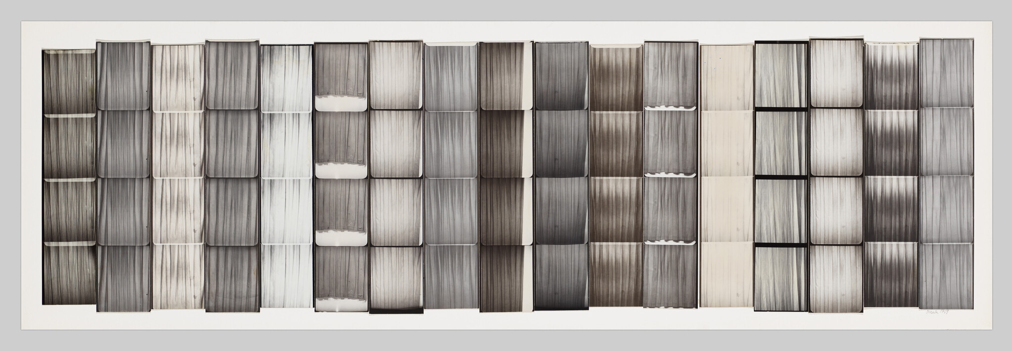 Rows of rectangular panels showing vertical, curtain-like folds in varying gray tones.