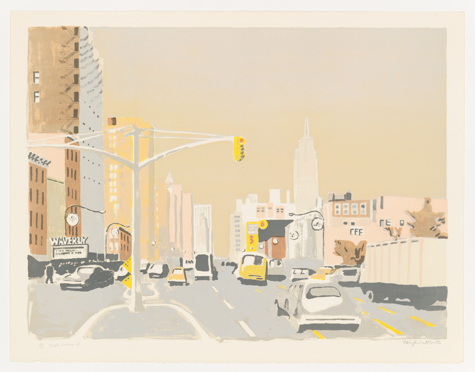 Morning traffic moves down a city avenue under a yellow traffic light and tall buildings.